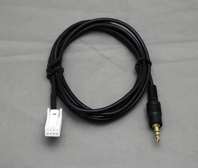 Nissan AUX 3,5mm įėjimo adapteris per CD changer jungtį